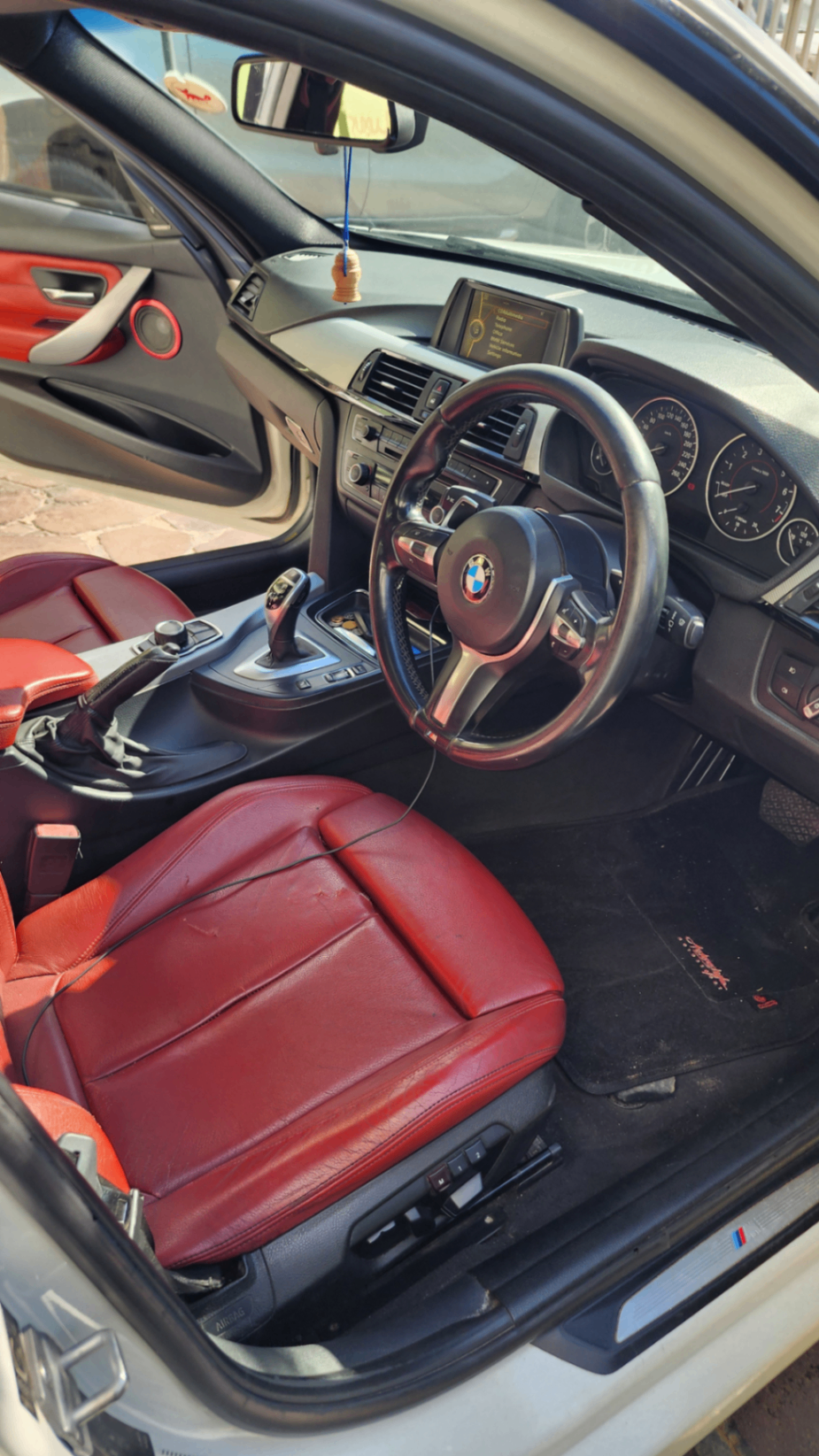 Red leather M-Sport interior and steering wheel
