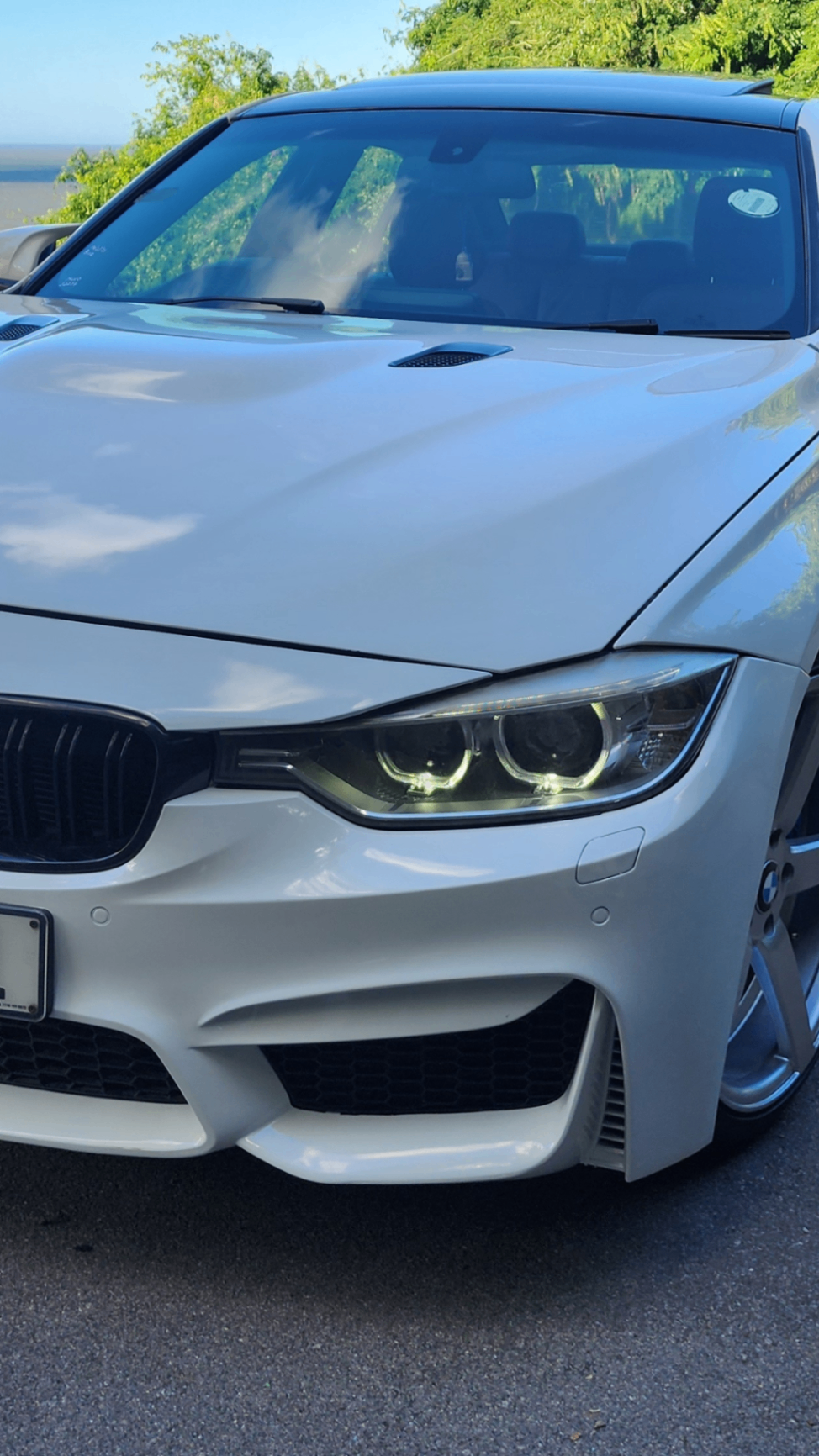 BMW 335i M-Sport headlight close up