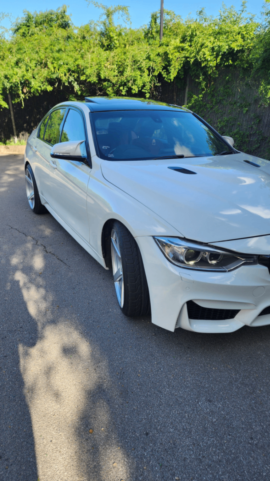 BMW 335i M-Sport side profile with sunroof
